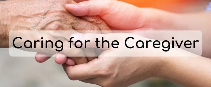Caring holding an elderly person's hand